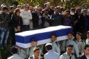 Israeli soldiers carry the flag-draped coffin of Captain Yochai Kalangel during his funeral at Mount Herzl military cemetery in Jerusalem