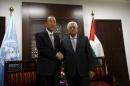 Palestinian President Mahmoud Abbas shakes hands with U.N. Secretary-General Ban Ki-moon before their meeting in the West Bank city of Ramallah