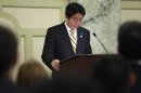 Japan's Prime Minister Shinzo Abe pauses during remarks at a reception with Japan-US Cultural Exchange Representatives in Washington