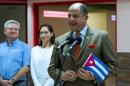 Costa Rican President Luis Guillermo Solis (R) delivers a press conference upon his arrival to Jose Marti International Airport in Havana, on December 13, 2015