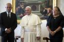 Pope Francis poses with Haiti's President Martelly and his wife Sophia during a meeting at the Vatican