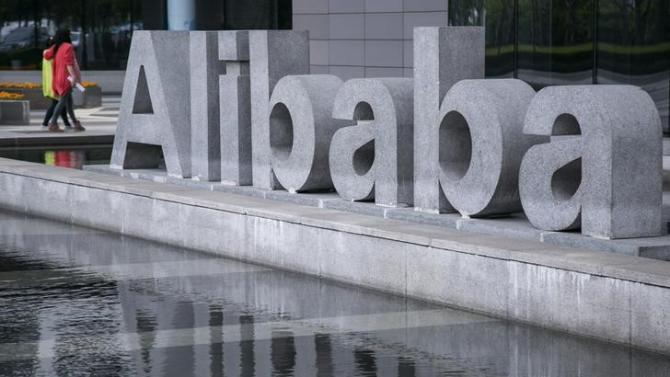 People walk at the headquarters of Alibaba in Hangzhou
