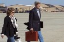 U.S. Secretary of State John Kerry and his wife Teresa Heinz Kerry board a second plane after their original aircraft had mechanical problems at Andrews Air Force Base in Maryland