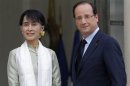 Myanmar pro-democracy leader Suu Kyi is welcomed by French President Hollande as she arrives in Paris