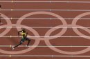Jamaica's Usain Bolt wins the finals of the men's 200-meter in the Olympic Stadium at the 2012 Summer Olympics, London, Thursday, Aug. 9, 2012. (AP Photo/Morry Gash)