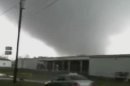 In this image made from video and released by WSB TV in Atlanta, a tornado moves through the town of Adairsville, Ga. on Wednesday, Jan 30, 2013. A fire chief says a storm that roared across northwest Georgia has left overturned vehicles on Interstate 75 northwest of Atlanta, and crews are responding to reports of people trapped in storm-damaged residential and commercial buildings. (AP Photo/WSB TV) MANDATORY CREDIT