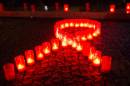 Candles form a red ribbon in Berlin, on November 30, 2013 during the World Aids Day