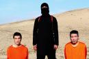 FILE - This file image taken from an online video released by the Islamic State group's al-Furqan media arm on Tuesday, Jan. 20, 2015, purports to show the group threatening to kill two Japanese hostages that the militants identify as Kenji Goto Jogo, left, and Haruna Yukawa, right, unless a $200 million ransom is paid within 72 hours. Yukawa went to Syria to train with fighters, and Goto is a freelance journalist respected for his reporting on refugees and children in war zones. (AP Photo/File) 
