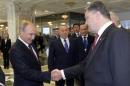 Russian President Vladimir Putin shakes hands with his Ukrainian counterpart Petro Poroshenko in Minsk