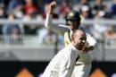 Australian bowler Nathan Lyon catches out West Indies' Jermaine Blackwood during their cricket test match in Melbourne, Australia, Sunday, Dec. 27, 2015. (AP Photo/Andy Brownbill)