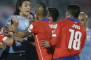Uruguay's Edinson Cavani, left, argues with Chile's Gonzalo Jara, right, during a Copa America quarterfinal soccer match at the National Stadium in Santiago, Chile, Wednesday, June 24, 2015. South American football officials will look into the actions of Jara, who was caught by TV cameras poking Cavani's behind to provoke a red card, which could lead to a suspension for the Chilean player. Cavani, Uruguay's top striker in the South American tournament, was sent off after the provocation by Jara, and Chile went on to win 1-0. (AP Photo/Ricardo Mazalan)