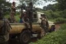 Former Seleka soldiers prepare to drive to a village, where residents say was attacked and a mosque burnt the night before by anti-Balaka militiamen, about 25 kilometres (16 miles) from Bambari