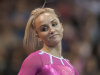 Nastia Liukin reacts after scratching from the uneven bars, at the U.S. Classic gymnastics meet Saturday, May 26, 2012, in Chicago. Olympic champion Liukin tied for third on balance beam in her first competition in three years. (AP Photo/Charles Rex Arbogast)