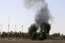 Smoke rises over the Airport Road area after heavy fighting between rival militias broke out near the airport in Tripoli