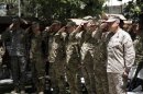 U.S. General Allen, commander of NATO forces in Afghanistan, and other military personnel stand at attention during U.S. Independence Day celebrations in Kabul