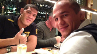 Antonio Silva and Junior dos Santos pose for a picture during a dinner. (Yahoo)