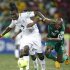Ghana's Boateng challenges Burkina Faso's Kabore for the ball during their AFCON 2013 semi-final soccer match in Nelspruit