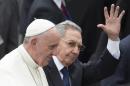 Cuba's President Raul Castro waves as he escorts Pope Francis at the airport in Havana, Cuba, Saturday, Sept. 19, 2015. Pope Francis began his 10-day trip to Cuba and the United States, embarking on his first trip to the onetime Cold War foes after helping to nudge forward their historic rapprochement. (AP Photo/Ramon Espinosa)