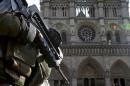 File picture shows an armed French soldier who patrols in front of Notre Dame Cathedral in Paris