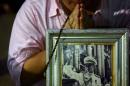 A well-wisher prays for Thailand's King Bhumibol Adulyadej at the Siriraj hospital where he is residing in Bangkok