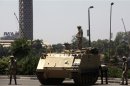 Egyptian soldiers stand guard near anti-Mursi protest in Cairo