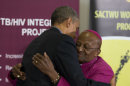 U.S. President Barack Obama, left, hugs Bishop Desmond Tutu during a visit to the Demond Tutu HIV Foundation Youth Center on Sunday, June 30, 2013, in Cape Town, South Africa. (AP Photo/Evan Vucci)