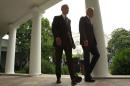 U.S. President Obama snd Vice President Biden walk back to the White House Oval Office after delivering statement on Supreme Court ruling on "Obamacare" in Washington