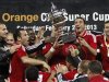 Egypt's Al-Ahly celebrate with the trophy after winning their Confederation of African Football (CAF) Super Cup soccer match against Congo's Leopards at the Borg El Arab Stadium, west of the Mediterranean city of Alexandria
