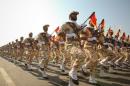 Members of Iranian revolutionary guard march during parade to commemorate anniversary of Iran-Iraq war, in Tehran