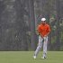 Amateur Guan Tianlang, of China, watches his ball after hitting in the rain on the eighth fairway during the second round of the Masters golf tournament Friday, April 12, 2013, in Augusta, Ga. (AP Photo/David J. Phillip)