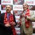 Chairman and CEO of The Coca-Cola Co., Muhtar Kent, right, holds a bottle of Coca Cola and President and CEO of Coca Cola India and South West Asia Atul Singh pose for photos before the start of a meeting in New Delhi, India, Tuesday, June 26, 2012. The world’s biggest beverage maker plans to invest US$5 billion in India from 2012 to 2020. It has already invested more than US$2 billion since re-entering the country in 1993. (AP Photo/Manish Swarup)