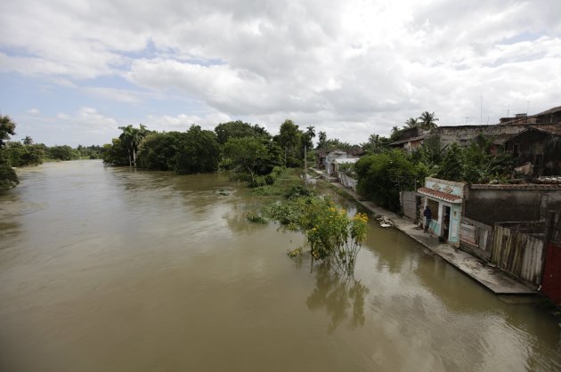 The Undoso River after it burst its banks due to rainfall from Hurricane Sandy, flooding part of the village of Sagua La Grande
