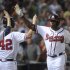 Atlanta Braves' Justin Upton, right, is congratulated as he comes back to the dugout after a home run against the Kansas City Royals during the eighth  inning of a baseball game, Tuesday, April 16, 2013, in Atlanta. Atlanta won 6-3. (AP Photo/John Amis)