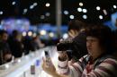 A person takes a picture of the new devices at the Mobile World Congress, the world's largest mobile phone trade show in Barcelona, Spain, Monday, March 2, 2015. (AP Photo/Manu Fernandez)