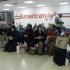 Passengers wait for their flight at at LaGuardia airport, Sunday, Oct. 28, 2012 in New York. Tens of thousands of residents were ordered to evacuate coastal areas Sunday as big cities and small towns across the Northeast buttoned up against the onslaught of a superstorm (AP Photo/Mary Altaffer)