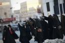 Bahraini women shout slogans during clashes with riot police in the village of Daih, west of the capital Manama, on January 4, 2016