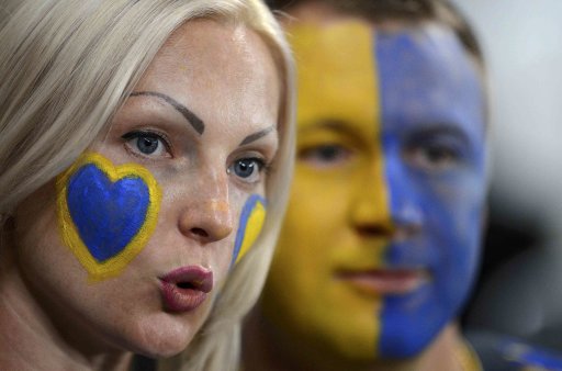 Fans of Ukraine cheer before their Group D Euro 2012 soccer match against England at Donbass Arena in Donetsk