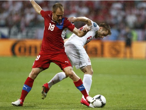Czech Republic's Kolar challenges Poland's Blaszczykowski during their Group A Euro 2012 soccer match at City stadium in Wroclaw