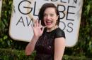 Elisabeth Moss arrives at the 71st annual Golden Globe Awards at the Beverly Hilton Hotel on Sunday, Jan. 12, 2014, in Beverly Hills, Calif. (Photo by Jordan Strauss/Invision/AP)