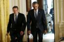 US President Barack Obama and British Prime Minister David Cameron walk into ther joint press conference following their meeting at the White House