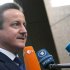 British Prime Minister David Cameron speaks with journalists as he arrives for an EU summit at the EU Council building in Brussels on Thursday, Nov. 22, 2012. EU leaders begin what is expected to be a marathon summit on the budget for the years 2014-2020. The meeting could last through Saturday and break up with no result and lots of finger-pointing. (AP Photo/Virginia Mayo)