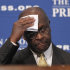 Republican presidential candidate, Herman Cain wipes his forehead before answering questions at the National Press Club in Washington, Monday, Oct., 31, 2011. Denying he sexually harassed anyone, Cain said Monday he was falsely accused in the 1990s while he was head of the National Restaurant Association, and he branded revelation of the allegations a "witch hunt.". (AP Photo/Pablo Martinez Monsivais)