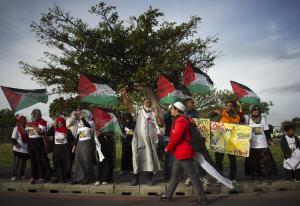 People hold Palestinian flags reading, &quot;Free Palestine&quot;&nbsp;&hellip;