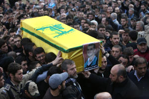 Mourners carry the coffin of Ali Khadra, who was killed …