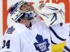 Toronto Maple Leafs goaltender James Reimer looks up as he celebrates the defeating the Ottawa Senators 4-1 after  an NHL game in Ottawa Saturday April 20, 2013. (AP Photo/The Canadian Press, Fred Chartrand)