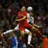 Liverpool's Downing challenges Hearts' Paterson during their Europa League soccer match at Anfield in Liverpool