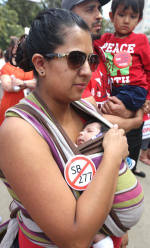 Angelica Saldivar, holding her three-week-old son,&nbsp;&hellip;