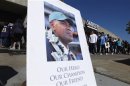 A picture of former San Diego Chargers and NFL linebacker Junior Seau is displayed as fans arrive at Qualcomm Stadium to participate in a "Celebration of Life" memorial, held in his memory in San Diego
