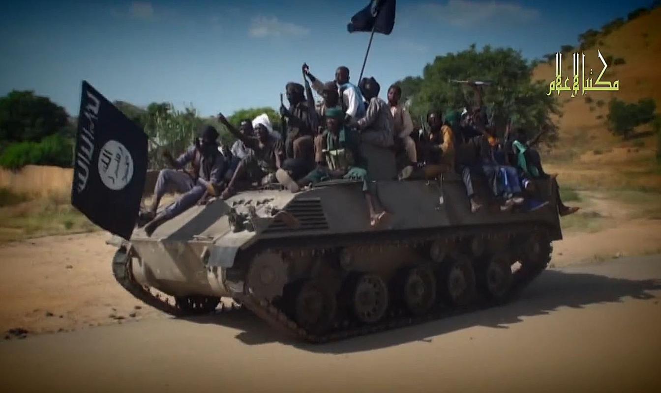 A screengrab taken on November 9, 2014 from a video released by the Nigerian Islamist extremist group Boko Haram and obtained by AFP shows Boko Haram fighters parading on a tank in an unidentified town