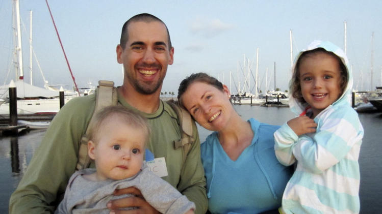 This undated image provided by Sariah English shows Eric and Charlotte Kaufman with their daughters, Lyra, 1, and Cora, 3. Rescuers have stabilized the condition Lyra, with her family on a crippled sailboat hundreds of miles off the coast of Mexico, and a U.S. Navy warship was headed toward the vessel, officials said Friday night, April 4, 2014. Their boat, the 36-foot Rebel Heart, was about 900 nautical miles southwest of Cabo San Lucas when they sent a satellite call for help to the U.S. Coast Guard Thursday morning saying their 1-year-old girl aboard was ill. (AP Photo/Sariah English)